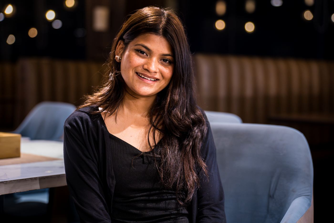 Anu, smiling warmly