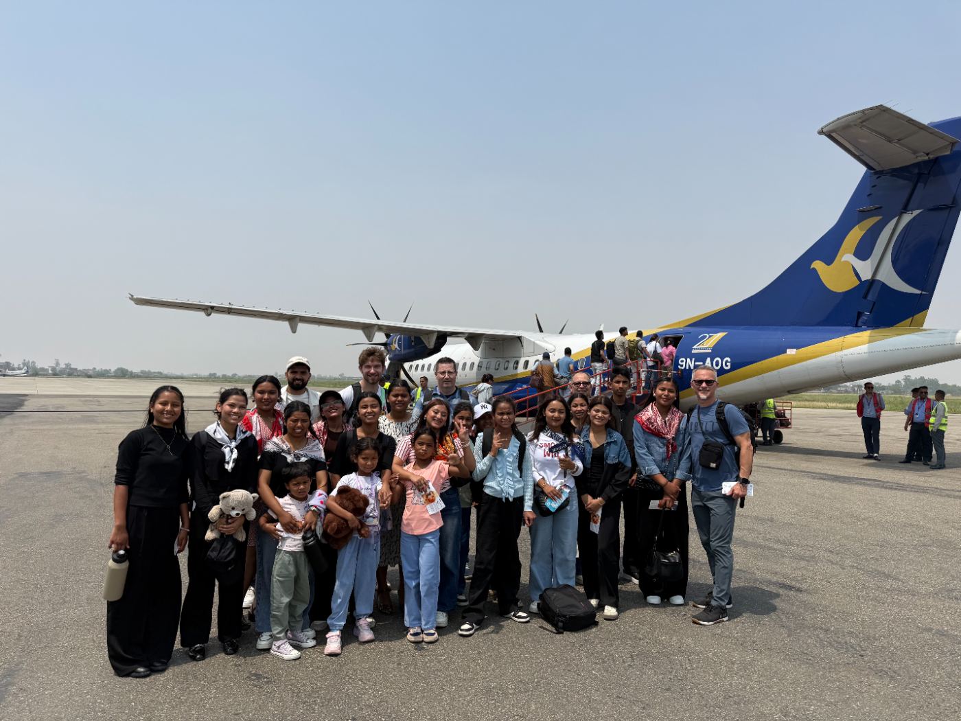 Vision Trip group beside the plane in Nepal